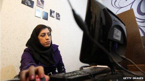 Woman surfs the internet in Tehran