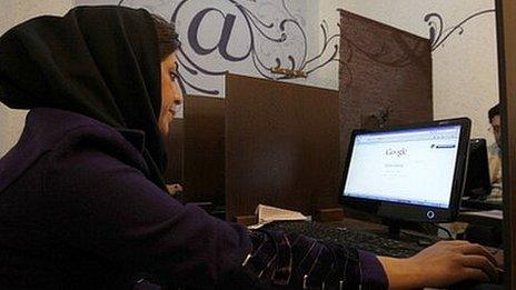 Iranian woman surfs the internet in Tehran
