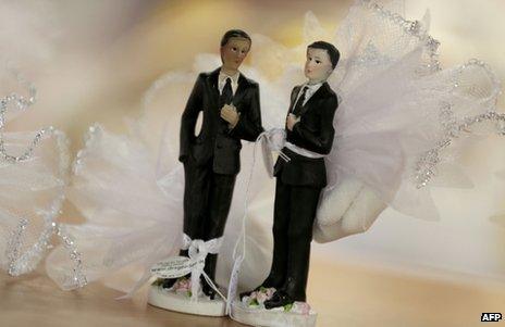 Male figurines in wedding dress on display in Paris (file image)