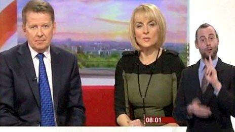 Screengrab of Rob Skinner signing to BBC Breakfast