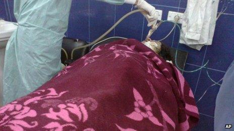 Woman treated in what rebels claim was chemical attack in Aleppo (April 13 2013 image provided by Aleppo Media Centre)