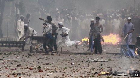 Bangladeshi protesters throw stones at police during a protest in Dhaka, 5 May 2013