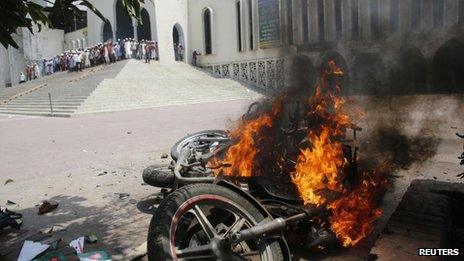 Burned motorcycles are seen after the clash in front of the national mosque in Dhaka, 5 May 2013