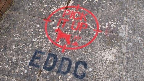 Spray-painted message on pavement
