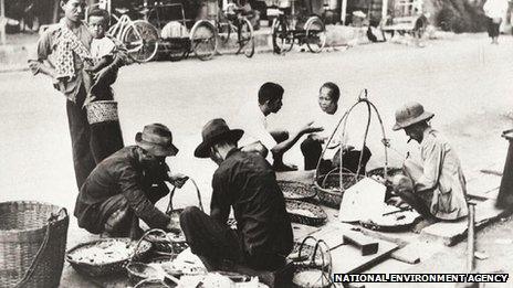 File photo: food hawkers on a street in Singapore