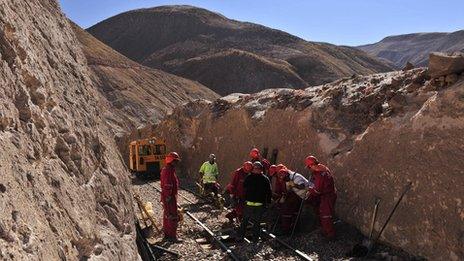 Workers carry out maintenance on the Arica-La Paz railway
