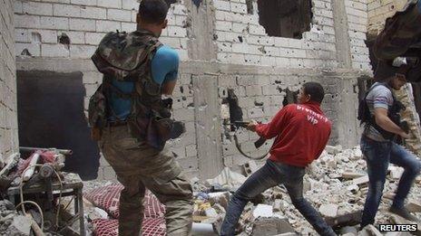 Syrian rebel fighters in Deir al-Zor, Syria, 13 May 2013