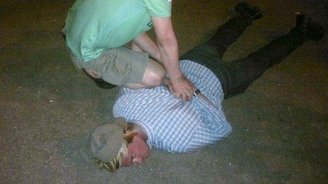 Photo allegedly showing Mr Fogle being held face down on the ground (14 May 2013)