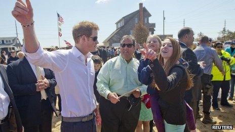 Prince Harry and New Jersey governor Chris Christie pose with the Bowden family on their empty lot in Mantoloking, New Jersey