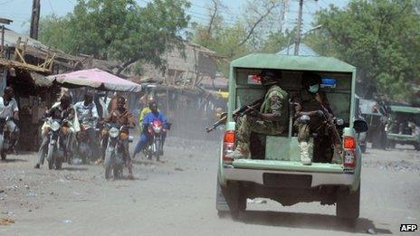 Troops patrol the streets of restive north-eastern Nigerian town of Maiduguri, Borno State, on 30 April 2013