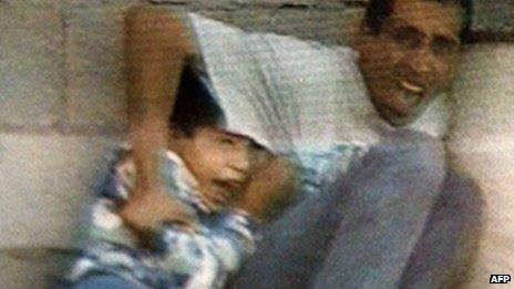 Frame from France 2 footage showing Mohammed and Jamal al-Dura under fire in Gaza (Sept 2000)