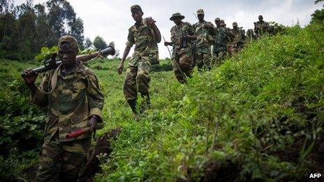 M23 rebels walking through hills in eastern Democratic Republic of Congo (30 November 2012)