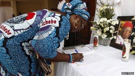 Mourner signs book of condolence in Ogidi. 23 May 2013