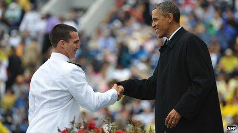 President Barack Obama congratulates a naval graduate in Annapolis, Maryland 24 May 2013