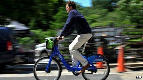 A man rides a Citi bike in New York City, 27 May 2013