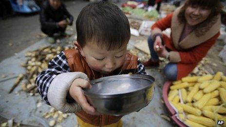 Child drinks from bowl (file image)