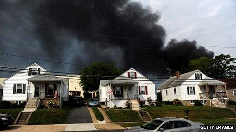 Smoke billows from a train derailment that caused a major explosion in the Rosedale neighbourhood 28 May 2013