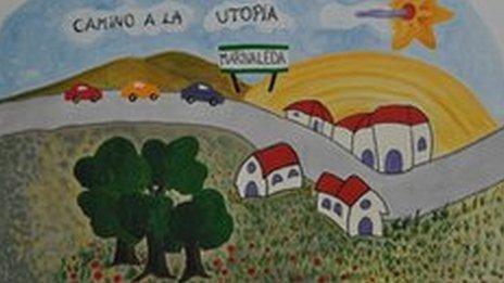 A mural in Marinaleda depicts cars on the "way to utopia"