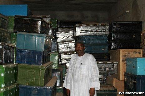 Dr Abdel Kader Haidara with boxes containing the rescued manuscripts