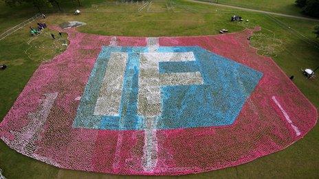 Aerial view of around 250,000 spinning flowers which were installed as a visual petition at Hyde Park, spelling out the word If, the campaign's logo