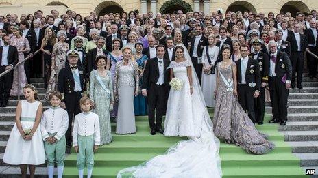 The newlyweds pose for photos with royal families and guests on 8 June