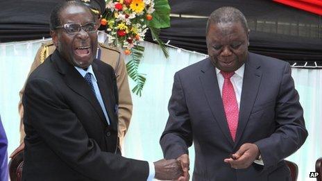 Robert Mugabe and Morgan Tsvangirai in Harare on 22 May 2013