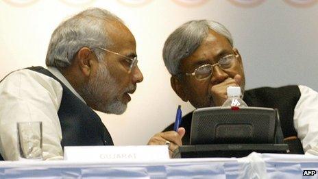 In this photograph taken on January 6, 2006, India's Gujarat state Chief Minister Narender Modi (L) talks with Bihar state Chief Minister and senior Janata Dal United (JDU) leader, Nitish Kumar, during a conference in Hyderabad