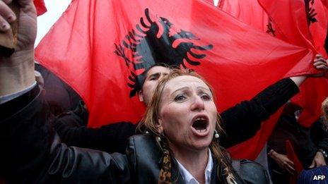 A supporter of the nationalistic party Red and Black Alliance protests in front of the government HQ in Tirana, 7 Apr 13