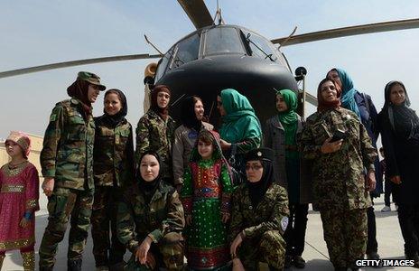 Latifa Nabizada and other women in front of a helicopter