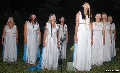 Worshippers take part in a play on Mount Olympus