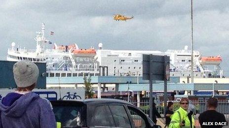 Helicopter hovering over ship
