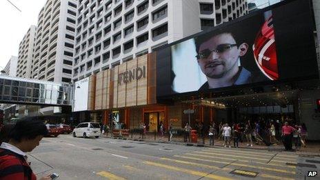 A TV screen shows a news report of Edward Snowden in Hong Kong. Photo: 22 June 2013