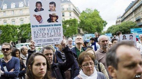 Supporters of four French hostages gather outside Paris City Hall. 22 June 2013