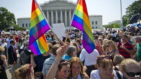 People celebrate outside the Supreme Court after two historic gay marriage rulings in Washington DC 26 June 2013