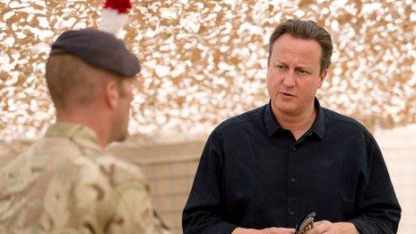 David Cameron talking to a soldier