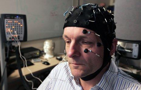 Michael Mosley with an electroencephalograph cap on to measure his brain's electrical activity