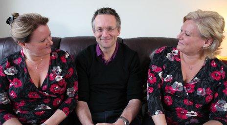 Michael Mosley sitting in the middle of twins Debbie and Trudi