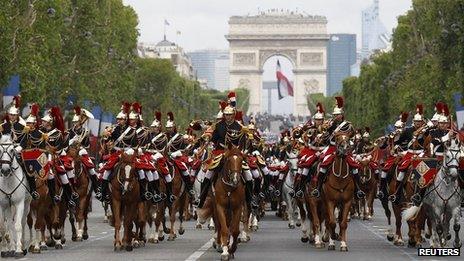 The Republican Guard ride down the Champs Elysees during the Bastille Day parade, 14 July 2012