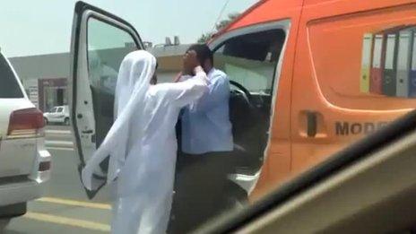 Screenshot of YouTube video showing man attacking a van driver with his agal - the rope used to keep the traditional Arab head dress in place.