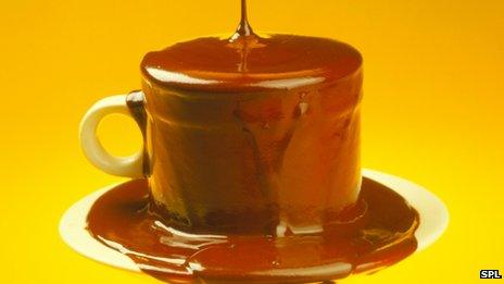Cup overflowing with chocolate