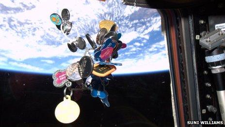 Dog tags float in the ISS