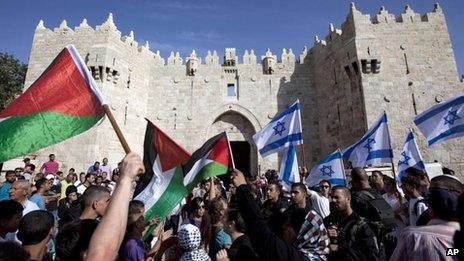 Israeli and Palestinian flags outside Damascus Gate, Jerusalem (file photo)