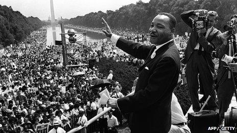 Martin Luther King waves to supporters 28 August 1963 on the Mall in Washington, DC