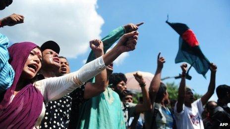 Bangladeshi social activists shout slogans against the verdict on Ghulam Azam in Dhaka on June 15, 2013.