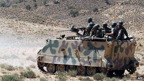 A picture taken on June 11, 2013 shows Tunisian soldiers patrolling in the Mount Chaambi region where the Tunisian army has been tracking militants the government says are veterans of the Islamist rebellion in northern Mali with links to Al-Qaeda in the Islamic Maghreb.