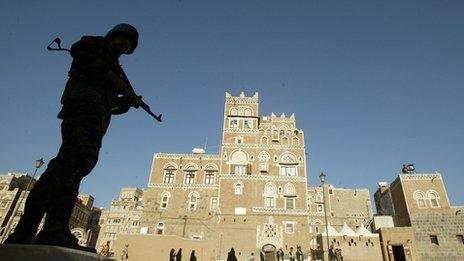 A Yemeni soldier stands guard in old Sanaa