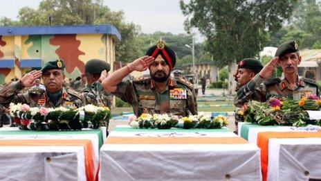 Indian army chief General Bikram Singh with the coffins of the killed soldiers in Jammu on 7 Aug 2013