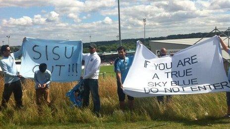Some fans protesting outside Northampton's ground on Sunday before the match