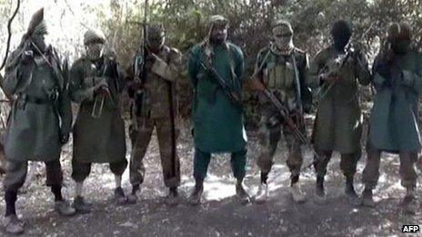 Militant leader believed to be Abubakar Shekau (C), with armed and masked Boko Haram militia (file photo)