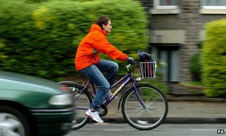Woman cycling in Cambridge